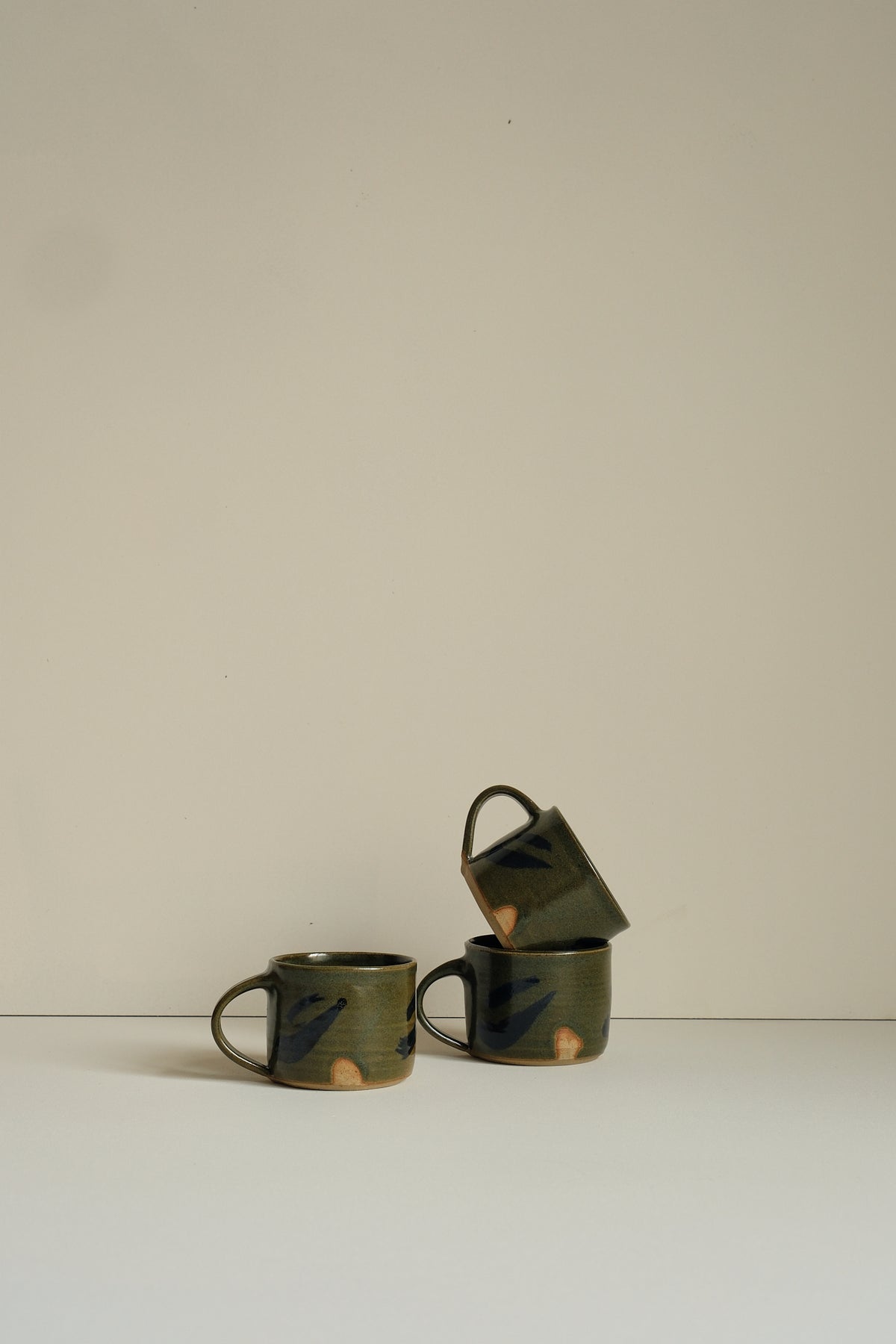Abstract Moss Coffee Cup by Hannah Burgess