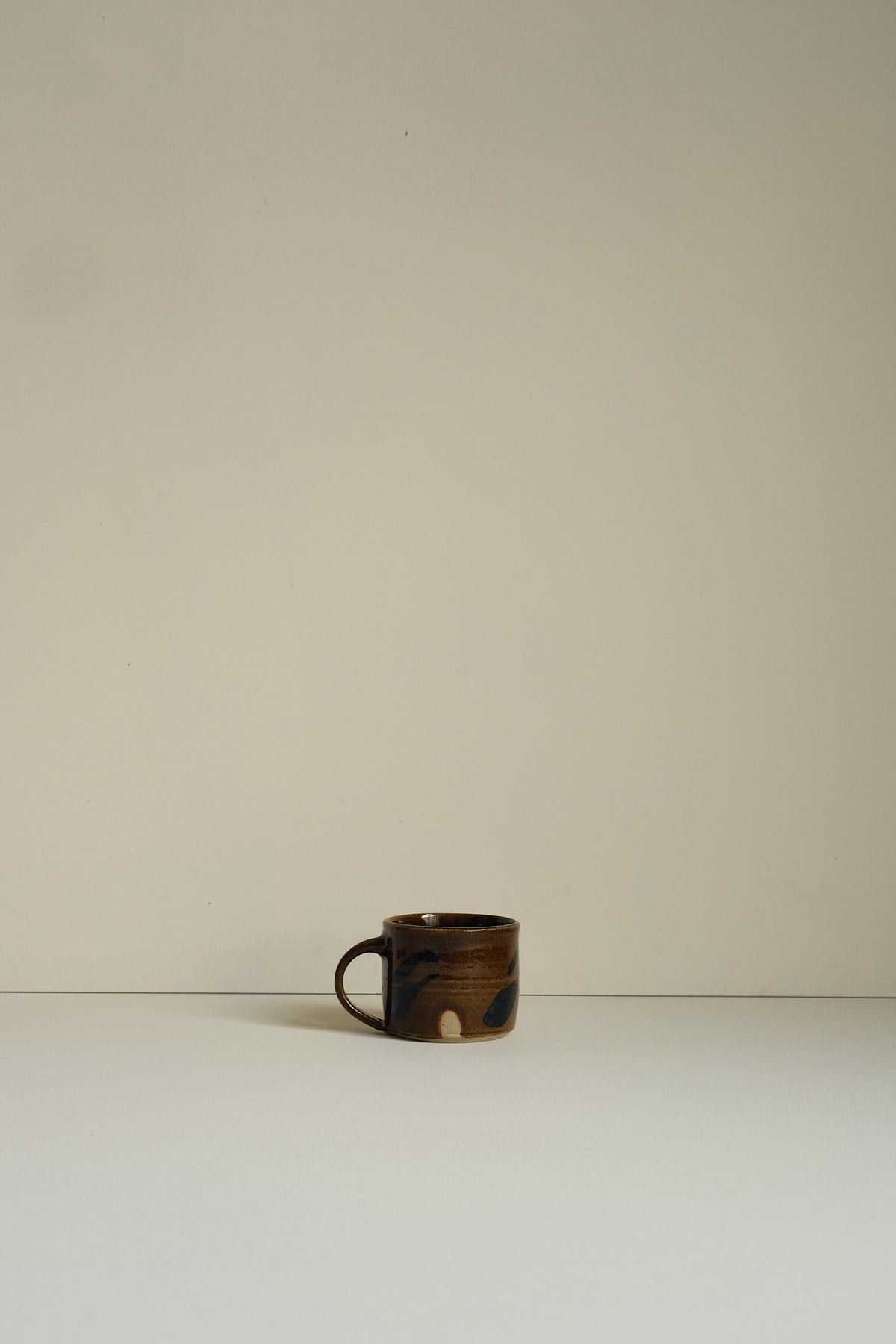 Abstract Umber Coffee Cup by Hannah Burgess