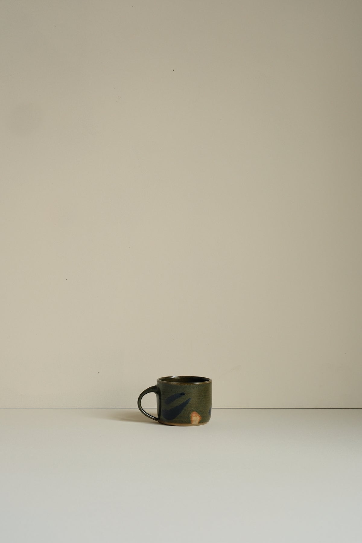 Abstract Moss Coffee Cup by Hannah Burgess