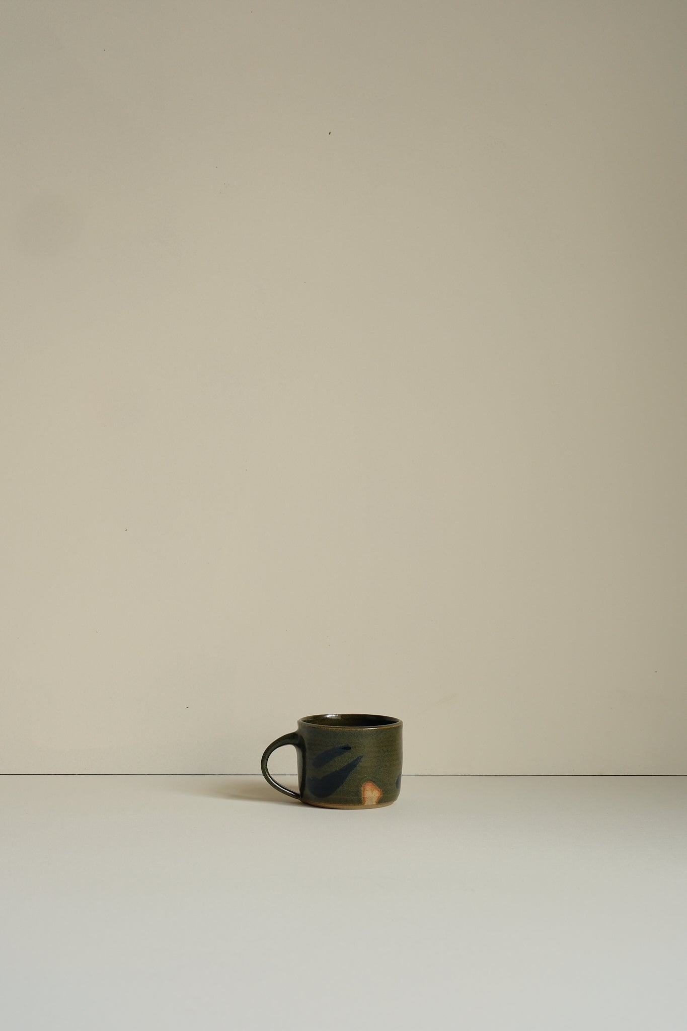 Abstract Moss Coffee Cup by Hannah Burgess