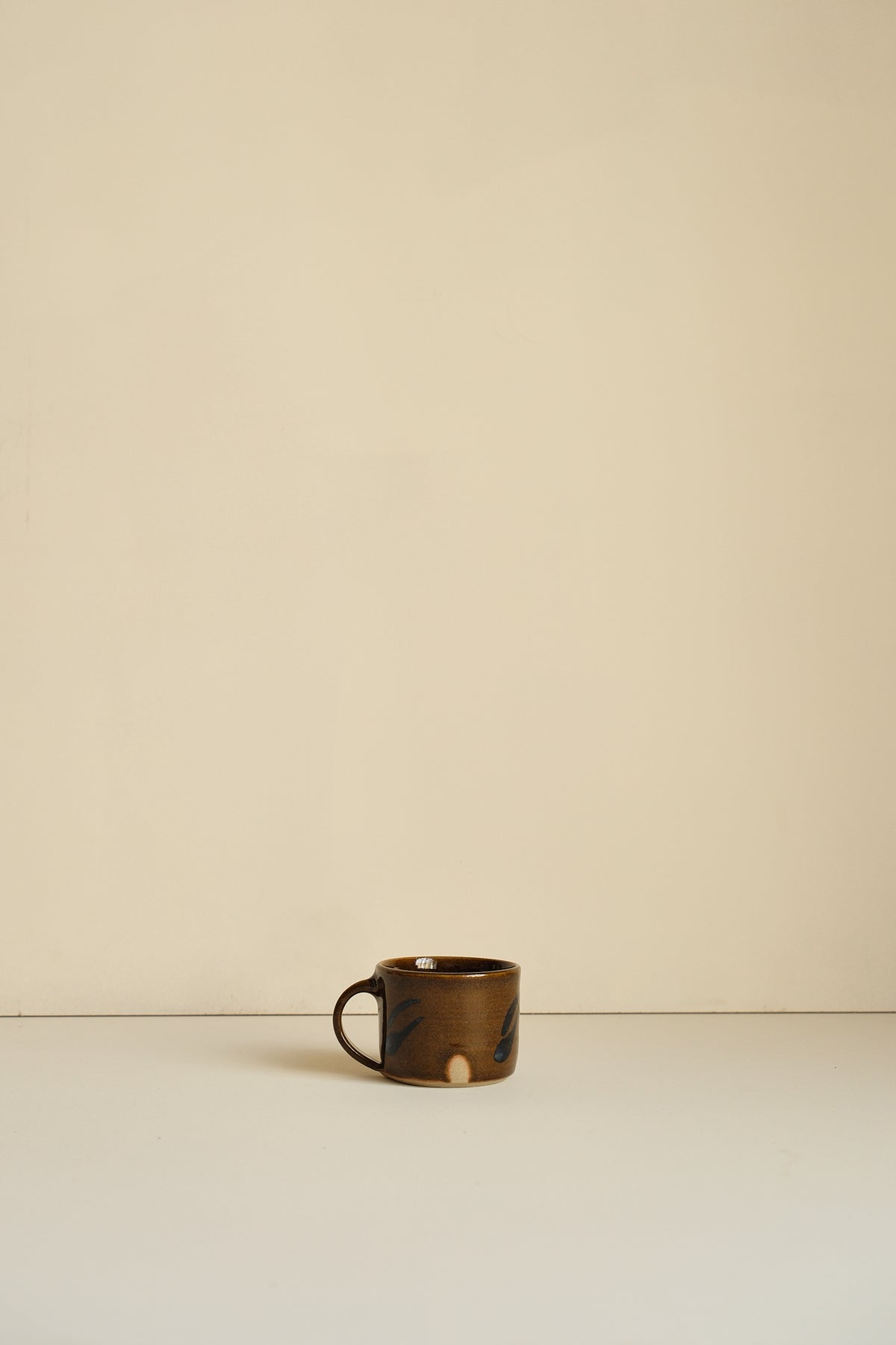 Abstract Umber Coffee Cup by Hannah Burgess