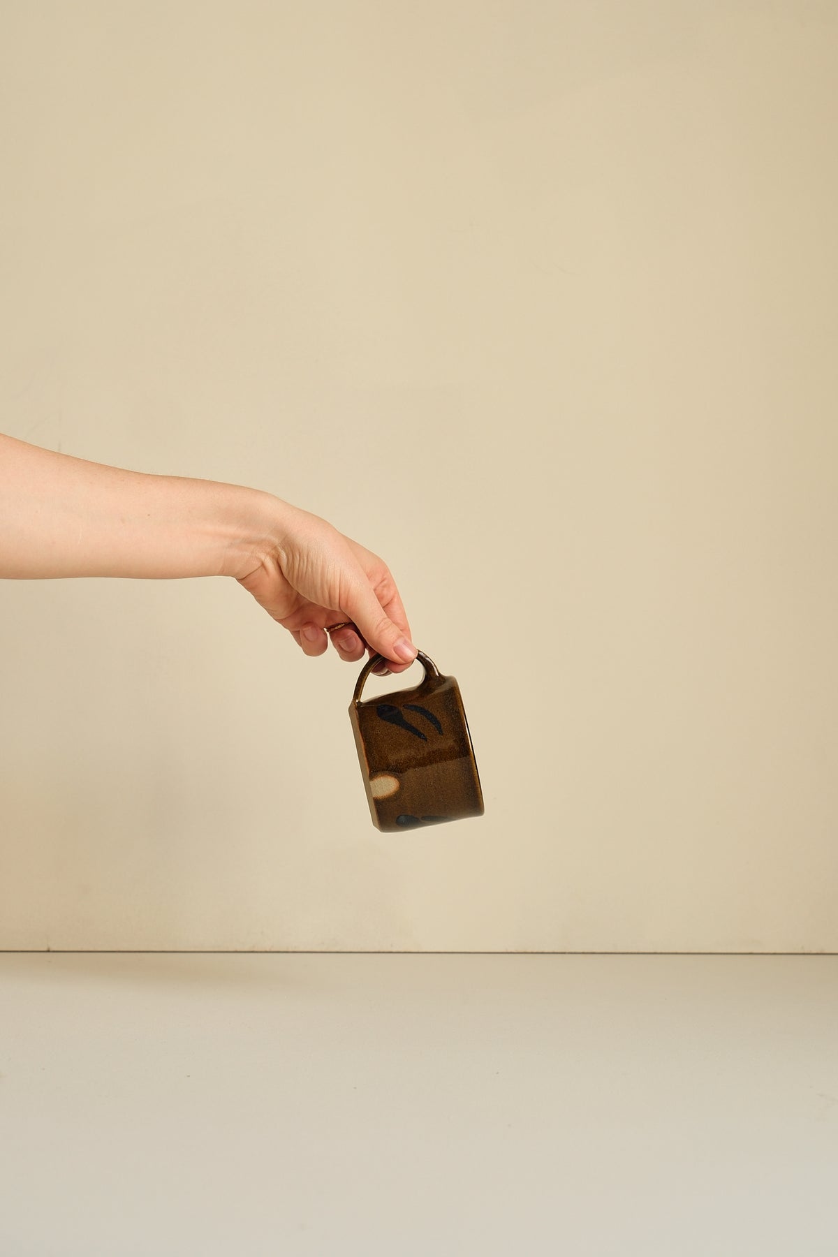 Abstract Umber Coffee Cup by Hannah Burgess