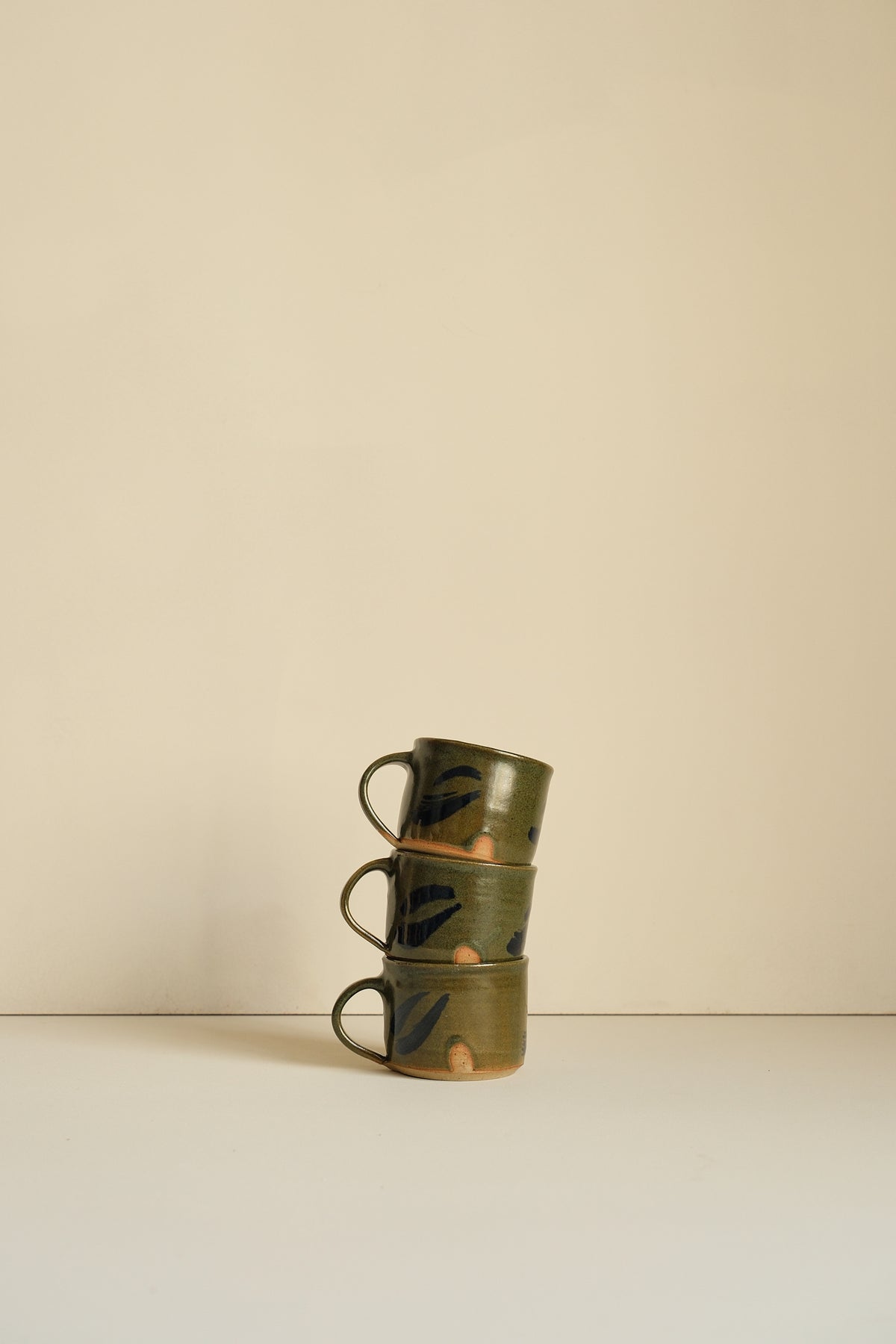 Abstract Moss Coffee Cup by Hannah Burgess