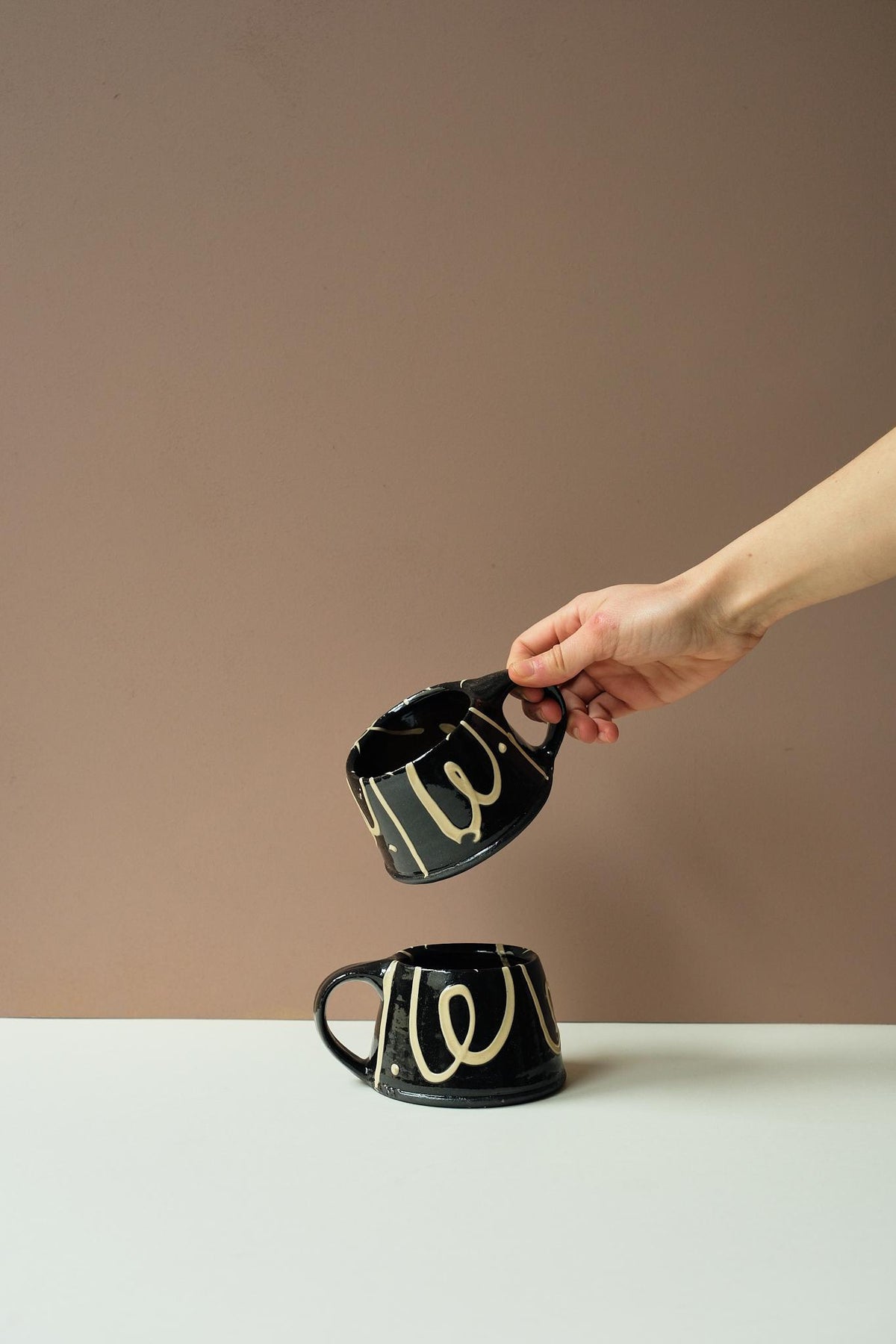 Black Mug by Mollie Milton