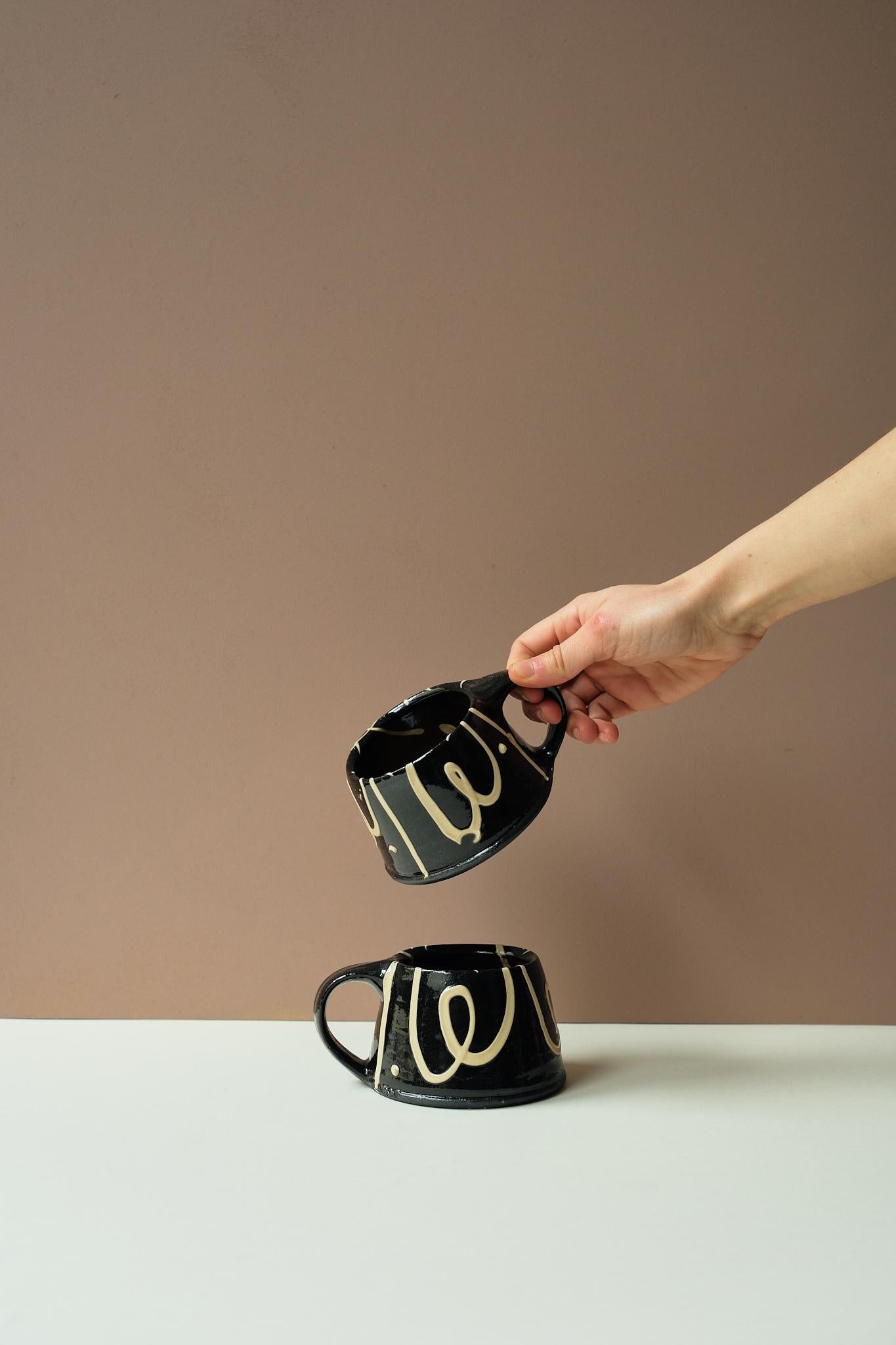 Black Mug by Mollie Milton