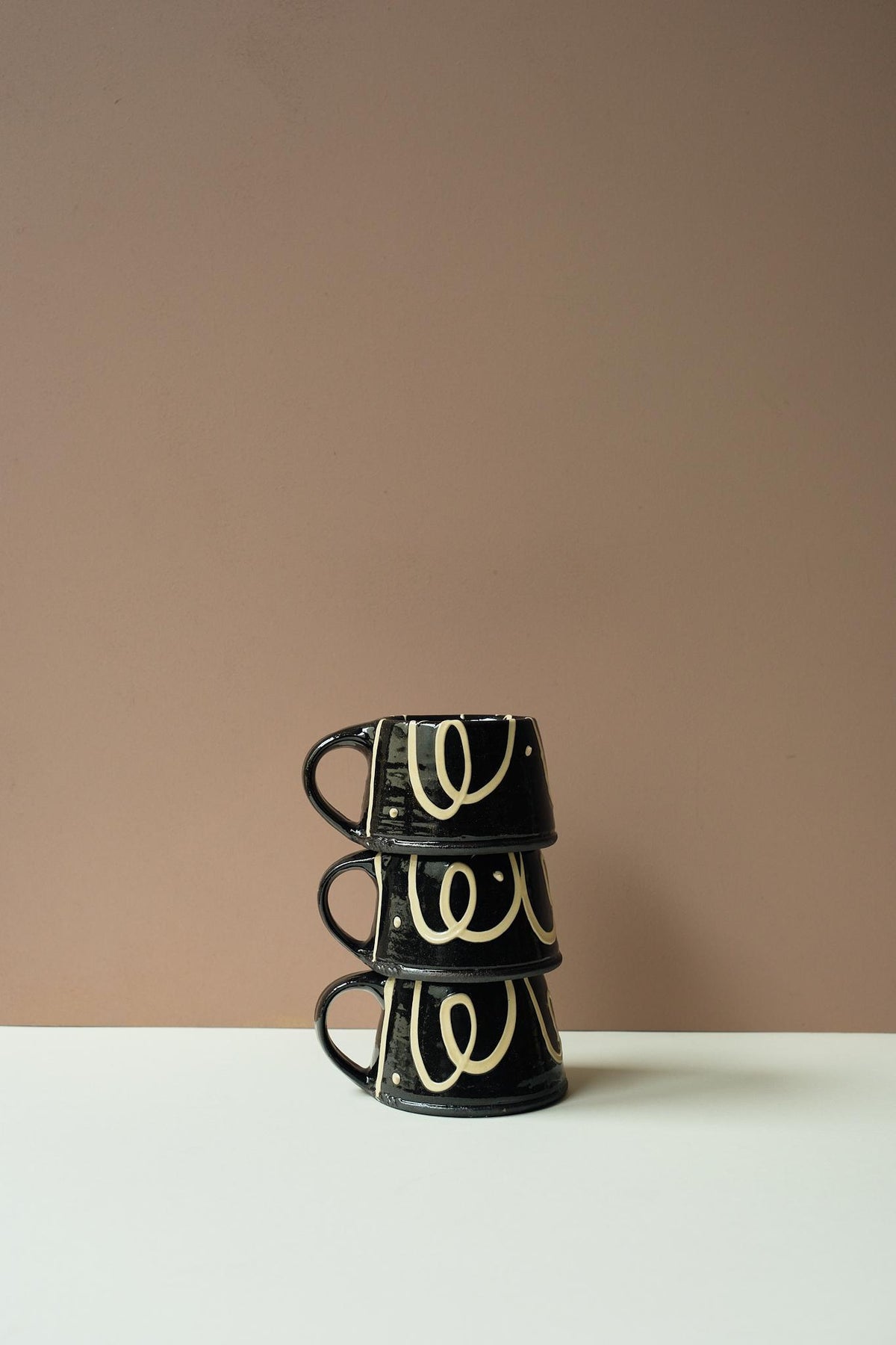Black Mug by Mollie Milton