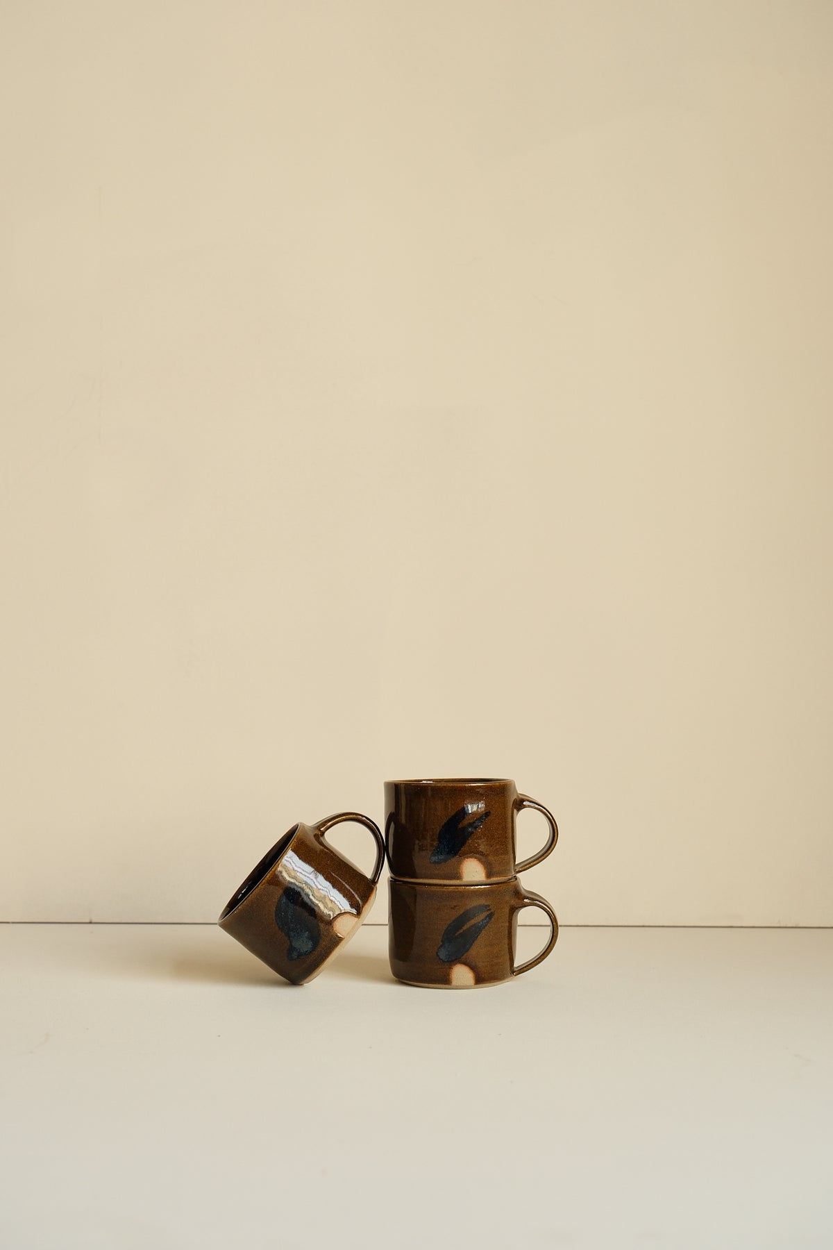 Abstract Umber Coffee Cup by Hannah Burgess