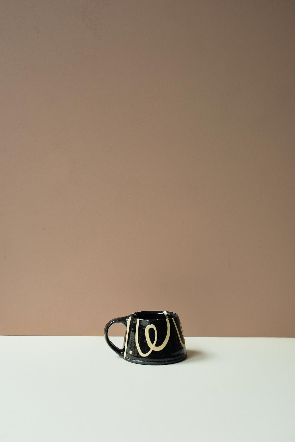 Black Mug by Mollie Milton